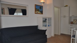 Residence San Teodoro 1. Soggiorno appartamento bilocale